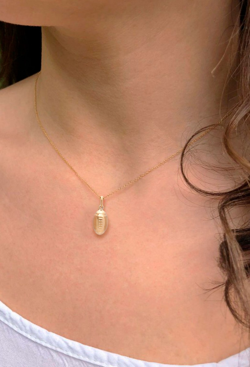 Colgante oro 18 kilates balón rugby 005_07906 Colgante oro 18 kilates balon rugby modelo niña