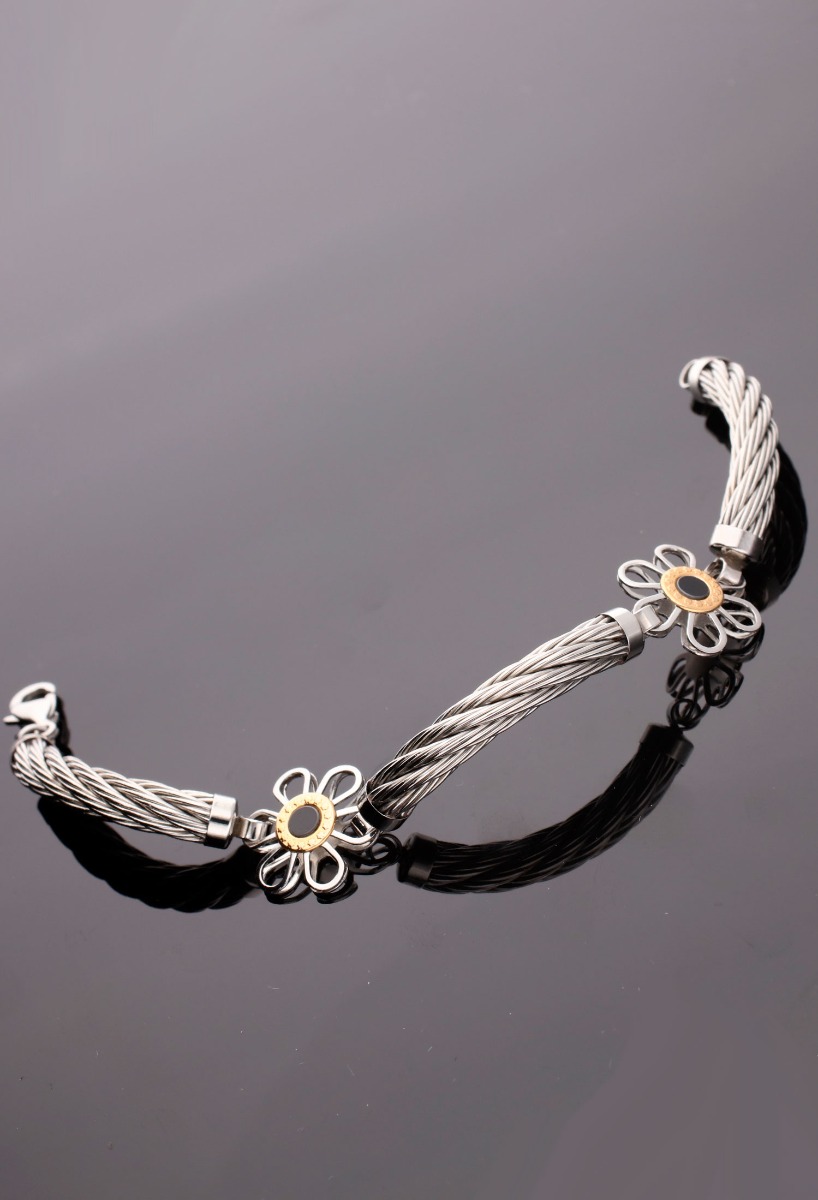 Pulseras acero y oro margaritas 094_61397-PUO-N pulsera acero y oro a precio de ocasion motivos margaritas foto para web el rubi joyeros toma sin recortar sobre base negra