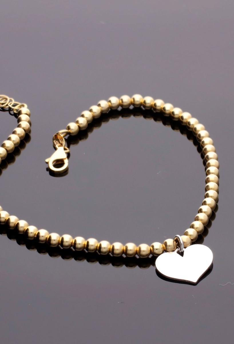 Pulsera oro 18 ktes eslabones bolas con fetiche en forma de corazón 243_028-09710 pulsera oro 18 ktes indicada para el dia de los enamorados foto fondo negro 243_028-09710_01
