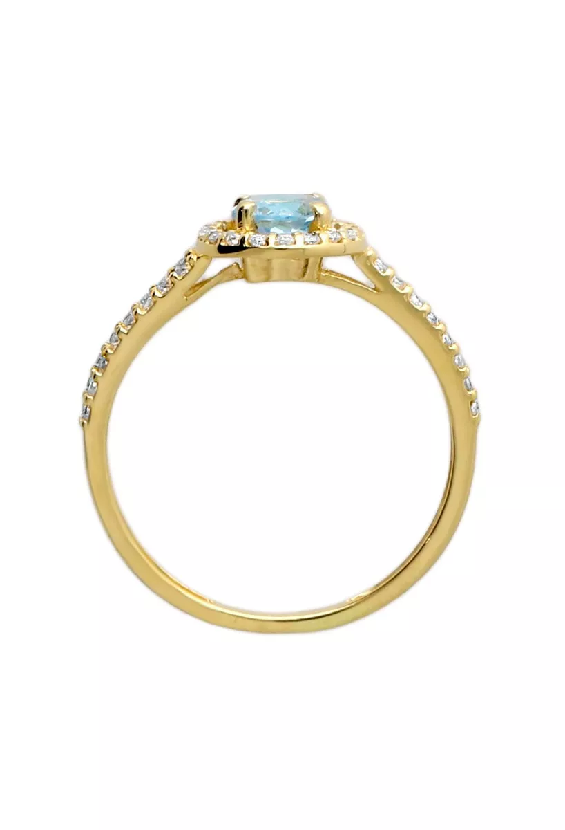 Anillo de oro amarillo 18k topacio azul orla circonitas 030_3737T-SOR anillo oro amarillo 18 kilates con topacio azul rodeado de circonitas fotografia cenital