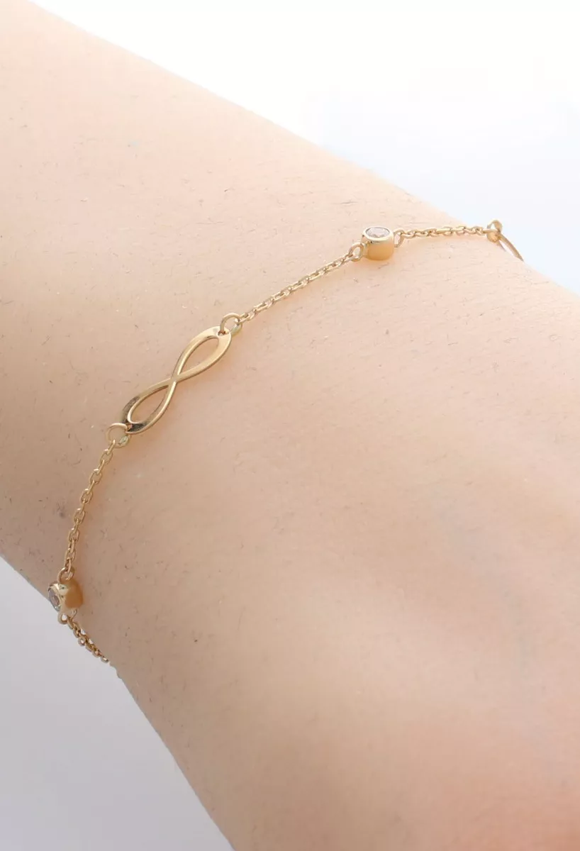 Pulsera de oro con entrepiezas infinito y cuatro chatones circonita 002_70667-PU 5