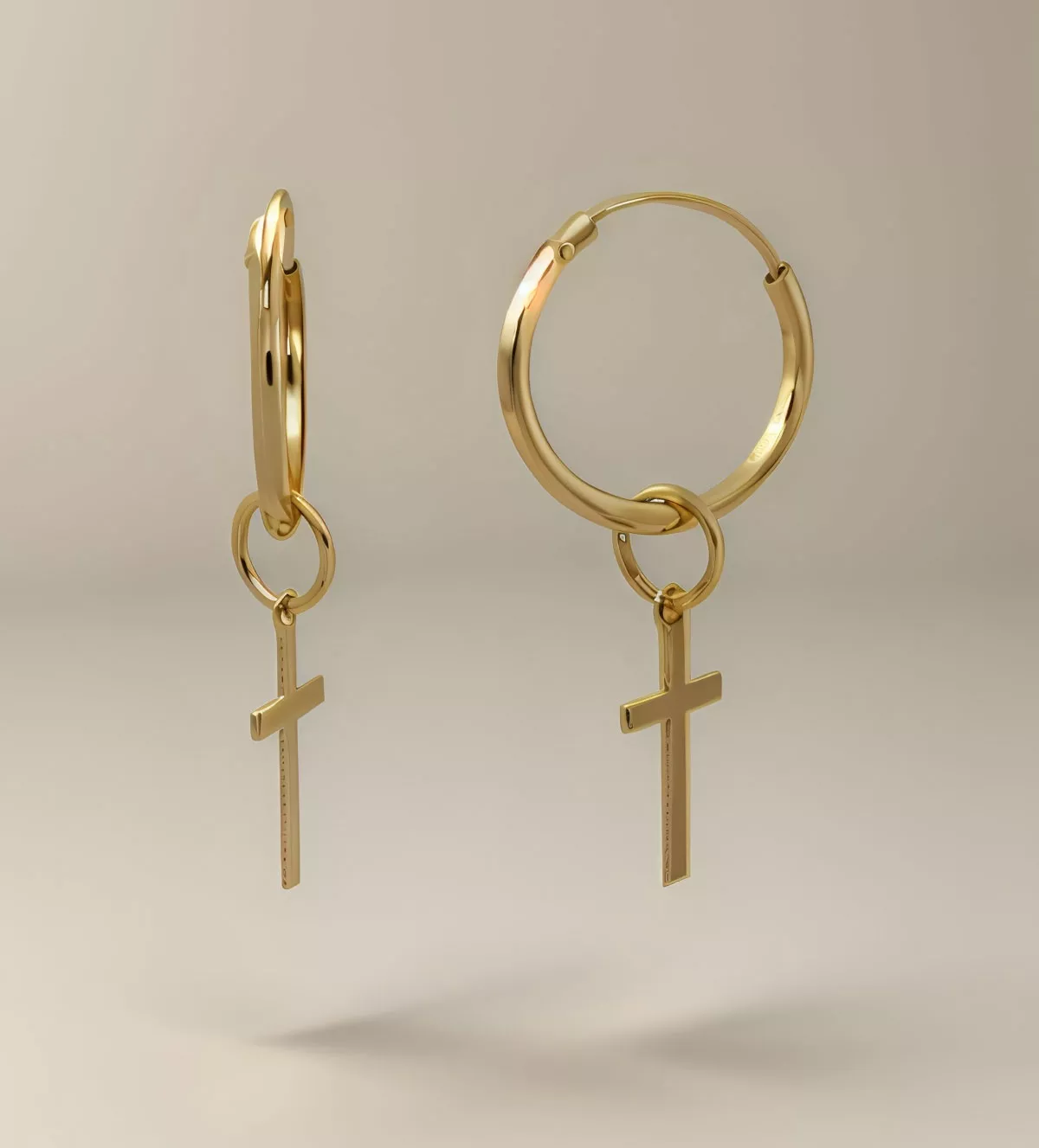 Pendientes de oro aros con cruz colgando pendientes de oro aros con cruz colgando toma fotofrafica